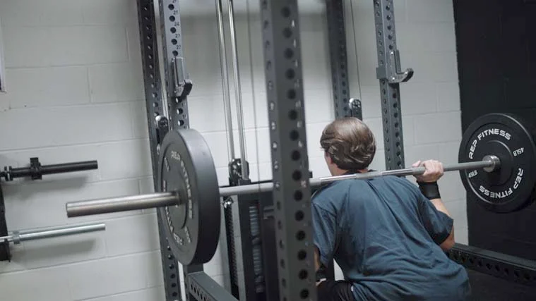 Jake Squatting in the REP PR-5000 Our tester squatting in the REP PR-5000.
