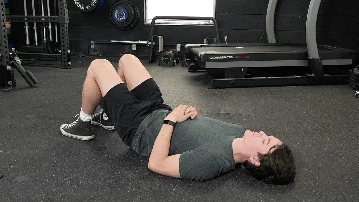 A person doing the figure four piriformis stretch.