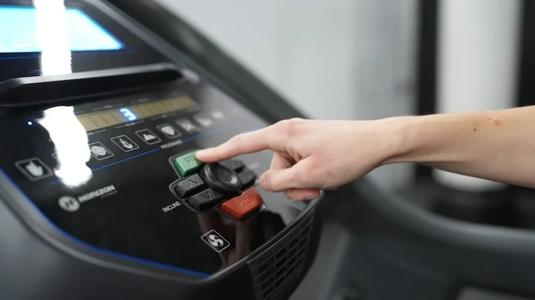 A BarBend tester adjusting the controls on the Horizon 7.4 AT center console.