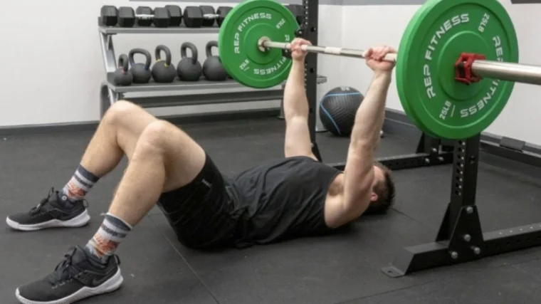 Man performing floor press
