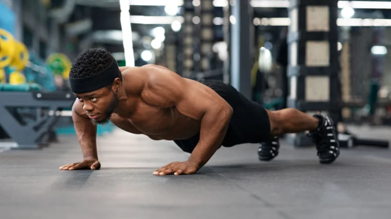 A person doing push-up workout in the gym.