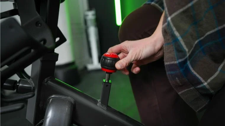 Our tester adjusting the resistance knob on the similar Schwinn IC4.