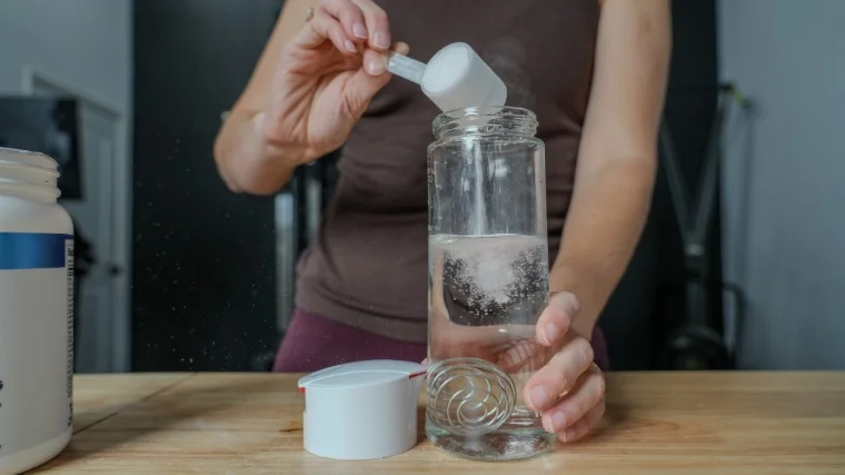 Our tester mixes up a serving of Bulk Pre-Workout.