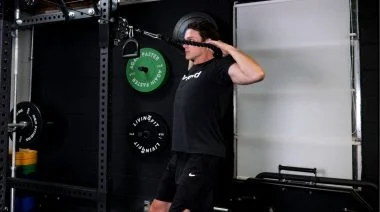 Jake performing face pulls in the Barbend gym.