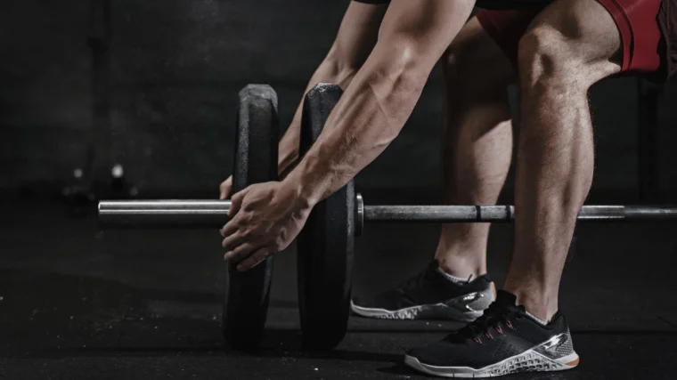 Closeup of athlete preparing for lifting weight.