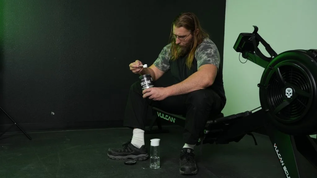 Our tester scoops up some creatine in the gym.