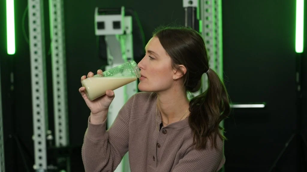 optimum nutrition 100 gsw close up drinking mixed drink