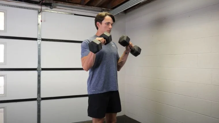 A person performing the hammer curl exercise.