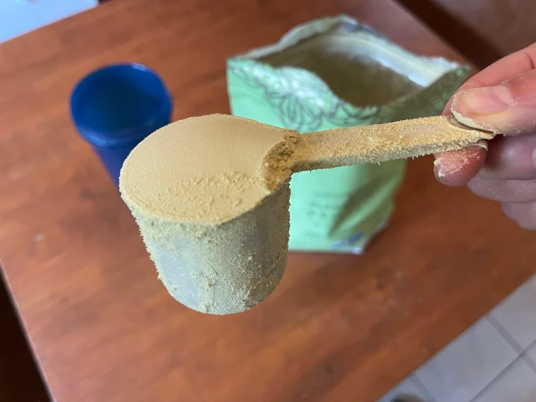 A close look at a scoop of Truvani Plant-Based Protein Powder.