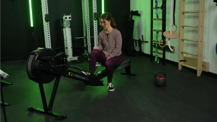 concept-2-rower-putting-foot-into-pedal Our tester on the Concept2 RowErg.