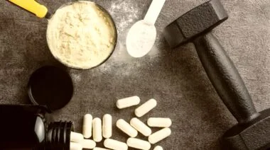 Creatine and BCAA supplements in scoops and capsules.
