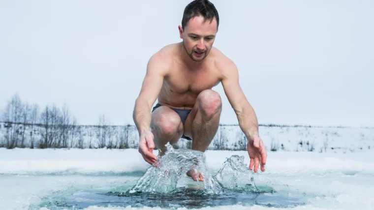 A person getting ready for the cold plunge.