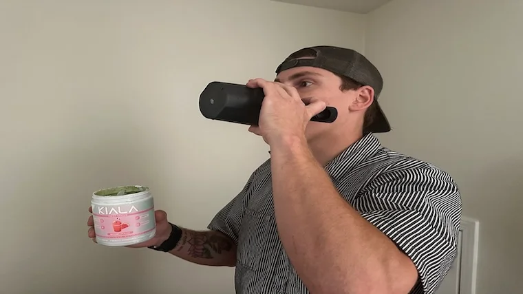 Our tester drinking a mix of Kiala Greens