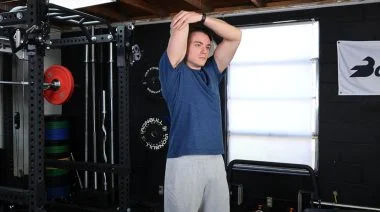 A person performing the overhead tricep stretch.