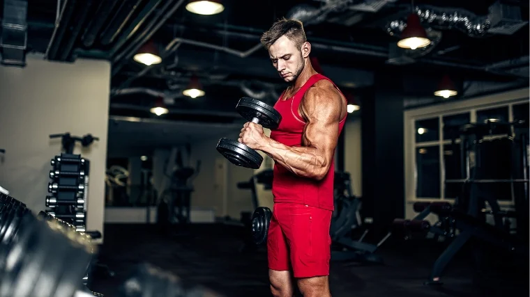 A person working out with dumbbells.