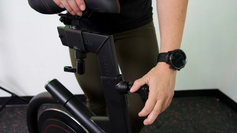 Adjusting seat height on the BowFlex VeloCore Bike.