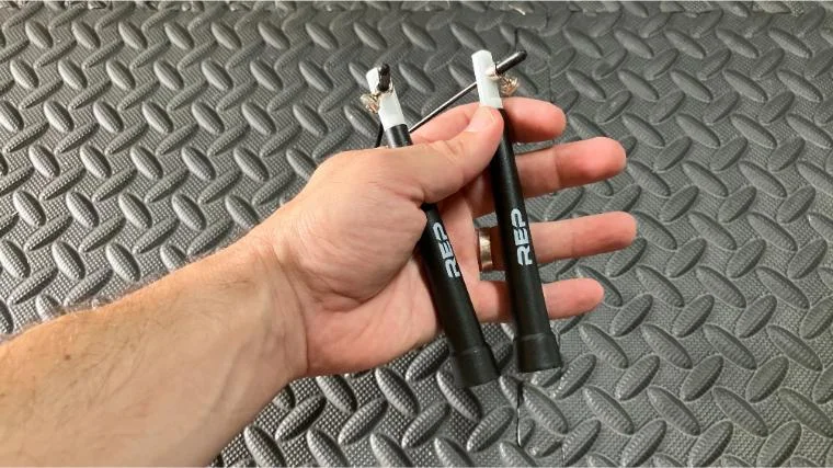 Our tester holding the handles of the REP Fitness Speed Cable Jump Rope.
