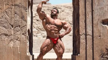 Hadi Choopan poses shirtless outdoors in Iran.