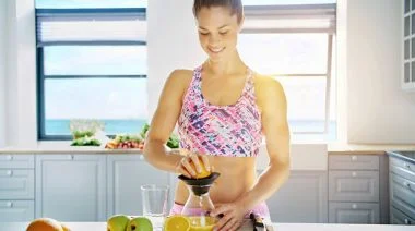 A person making a homemade electrolyte drink.