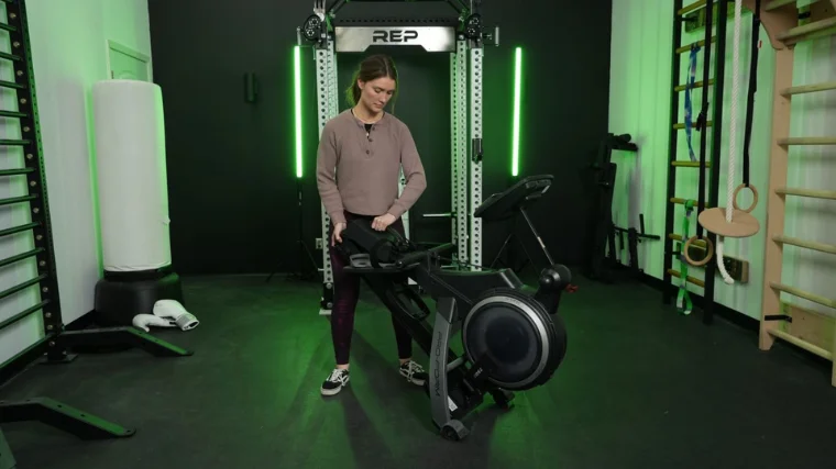 A person folding up the ProForm 750R rowing machine.