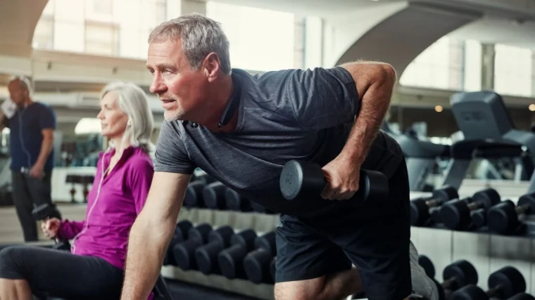A person performing the dumbbell row exercise.