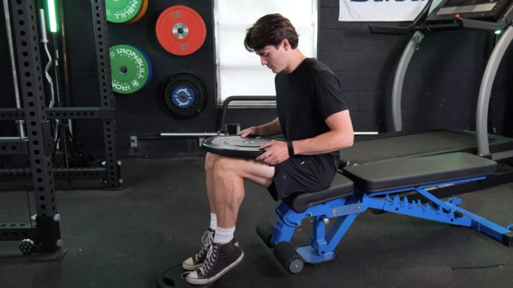 Our tester doing a seated calf-raise.