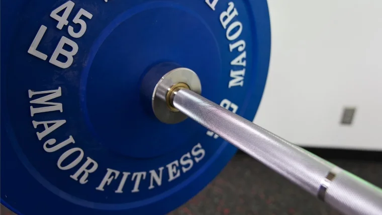 The knurling and collar on a Major Fitness Barbell Advanced