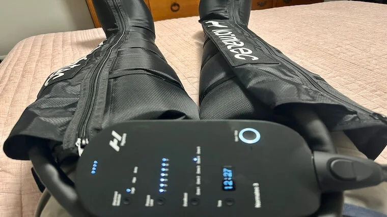 Our tester using the Normatec 3 leg attachments for a recovery session