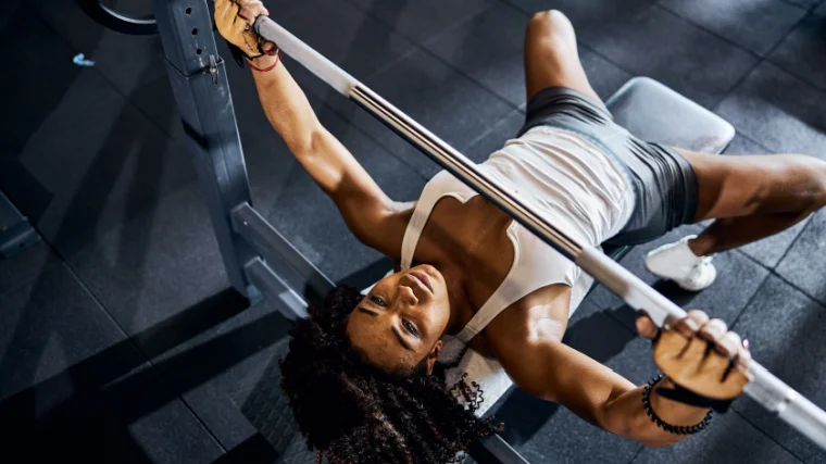 A person doing bench press exercises.