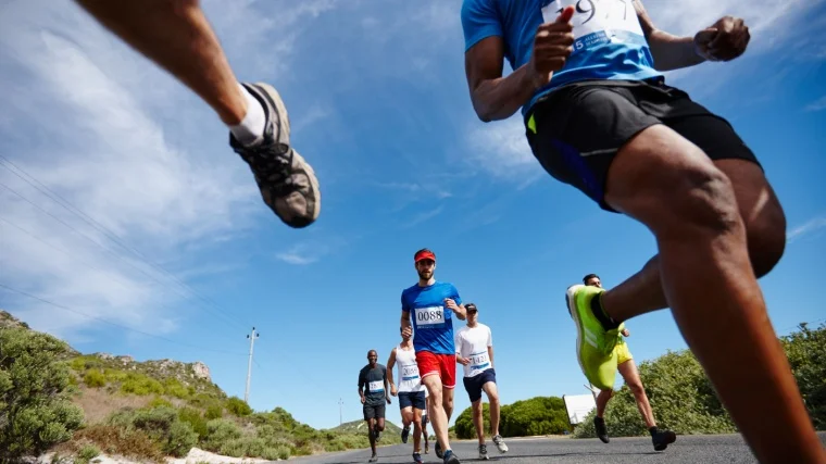 Fit athletes running outdoors.
