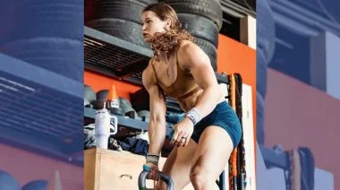 CrossFit athlete lifting a kettlebell.