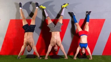 A group doing handstand pushups together.