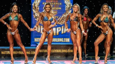 Bikini bodybuilders on a stage.