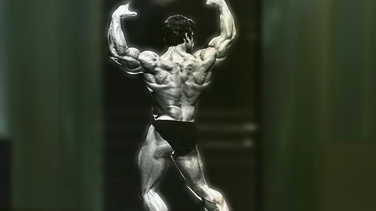 Bodybuilder Mike Mentzer performs a back-double-biceps pose.