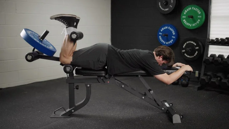Jake Doing Leg Curls on the Force USA MyBench