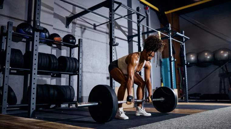 A person doing deadlifts.