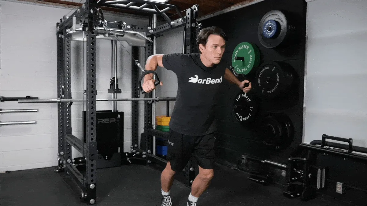 A person performing the cable chest flye exercise.