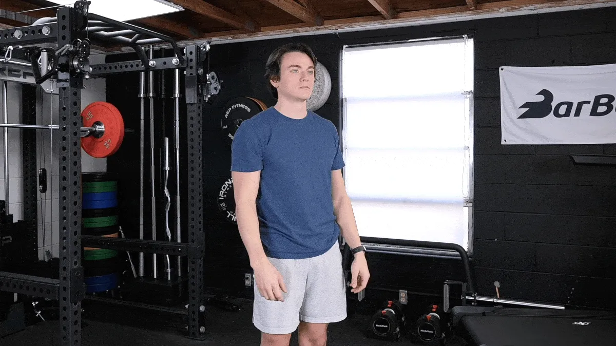 A person performing the overhead tricep stretch exercise.