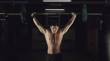 A person lifting a barbell.