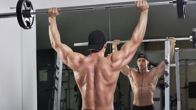 A person doing a shoulder press.