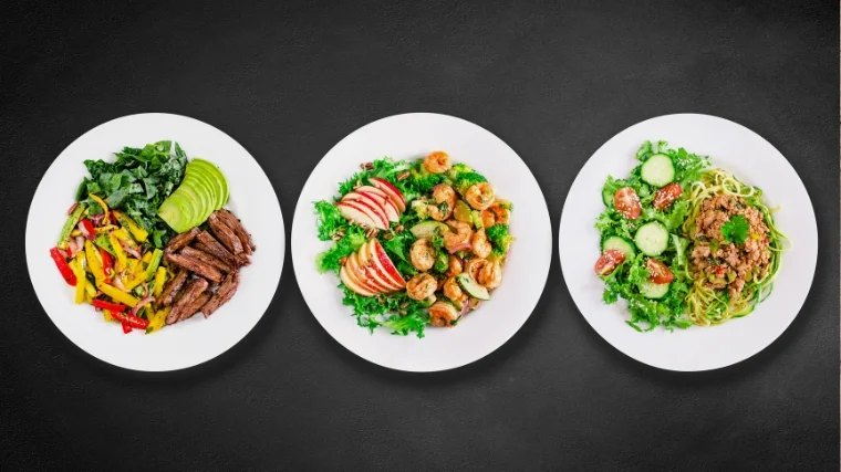 Three plates with different foods.