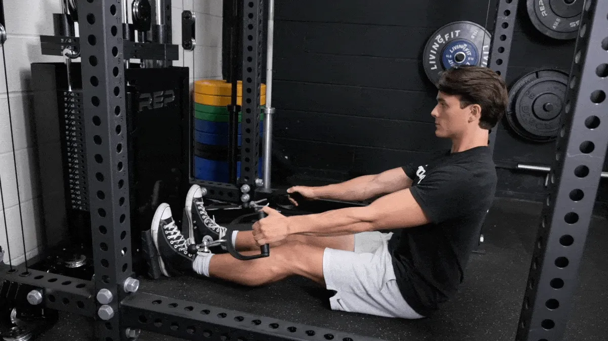 A person performing the seated cable row exercise.