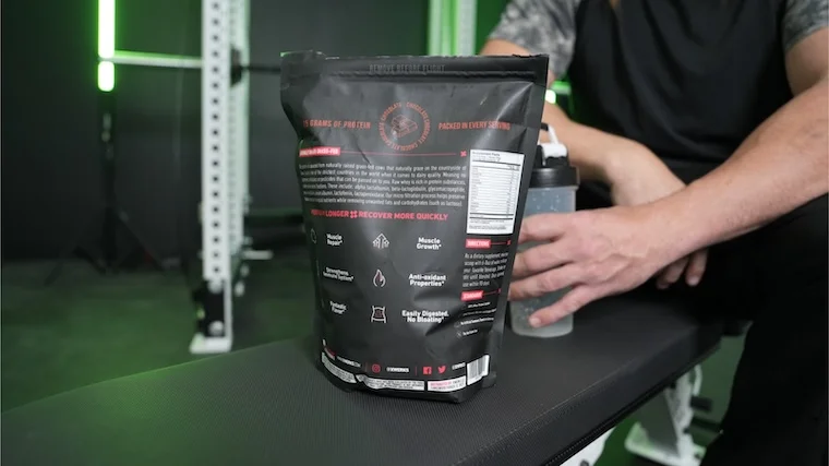 A person showing the XWERKS Grow protein powder nutrition label