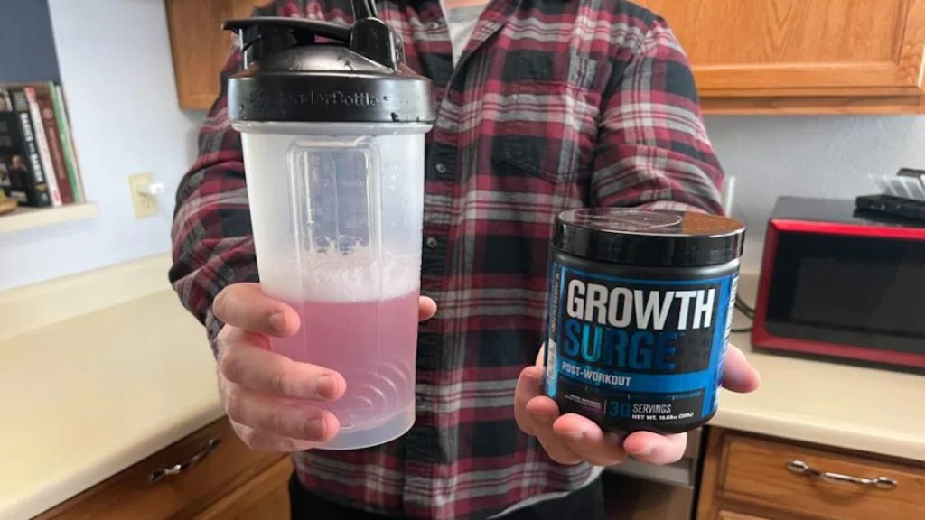 a man holding Jacked Factory Growth Surge