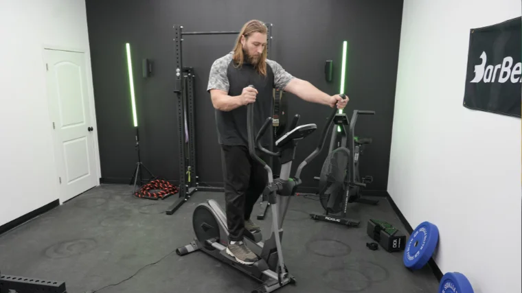 Our tester riding the Sunny Health and Fitness Elliptical SF E3912.