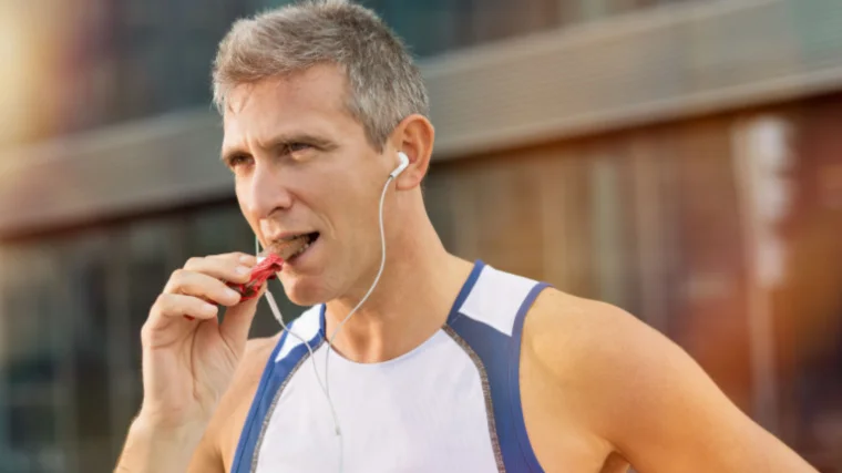 A person eating chocolate bar.