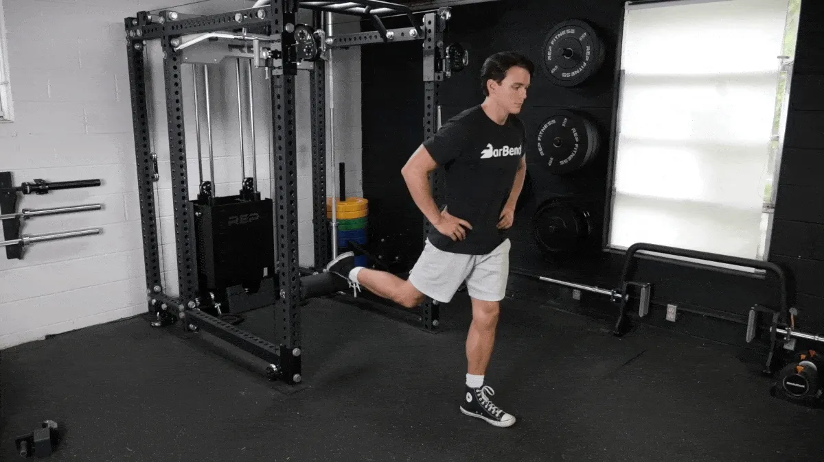 A person performing the bulgarian split squat exercise.
