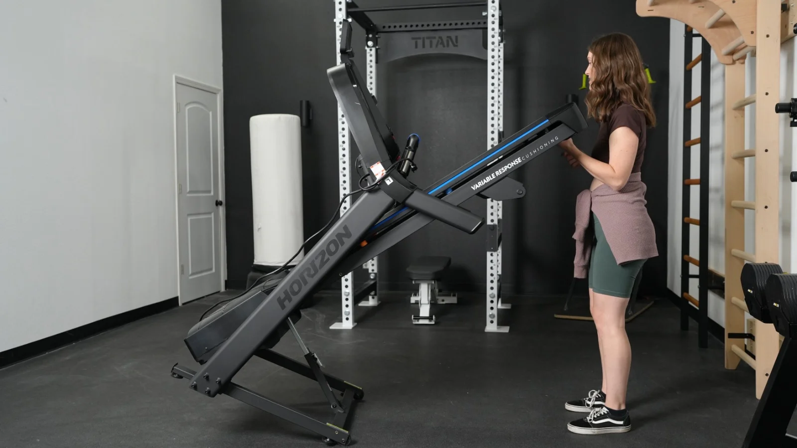 Our tester is shown unfolding the Horizon 7.0 AT treadmill.