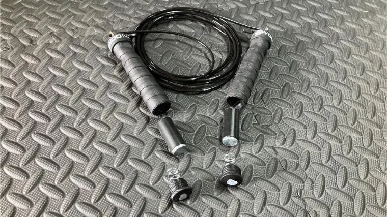 The removable weights that rest in the handles of the WOD Nation Atlas Weighted Jump Rope