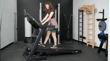 Our tester walking at an incline on the Sole F63 treadmill.